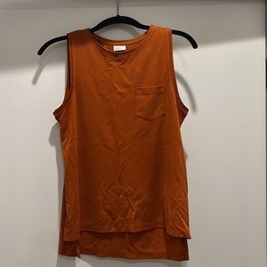 Burnt orange sleeveless blouse